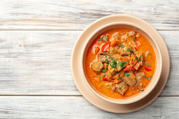 Traditional hungarian paprikash with turkey, bell pepper, carrot, onion, paprika and sour cream in...