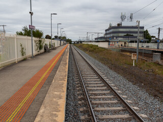 Fototapeta na wymiar Commuter train approaching a train station in Melbourne Victoria Australia