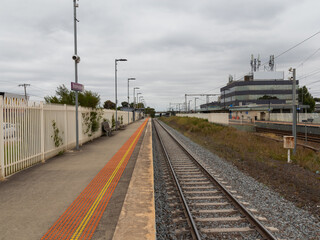 Fototapeta na wymiar Commuter train approaching a train station in Melbourne Victoria Australia
