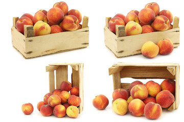 Fresh peaches in a wooden crate on a white background