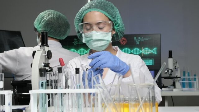 Scientists are researching for Covid19 vaccine in a laboratory. Doctors are testing  a new phamaceutical.