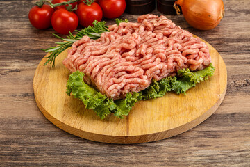 Raw pork minced meat over board