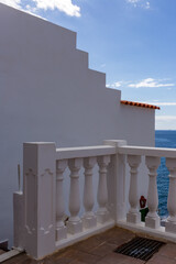 white house with balcony and sky in tenerife, canary island, spain