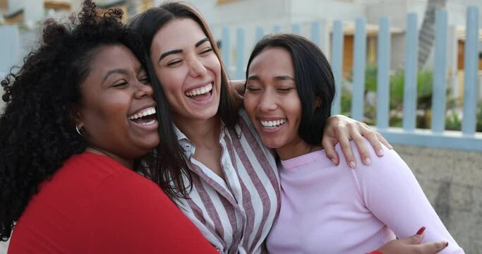 Happy latin girls having fun together outdoor