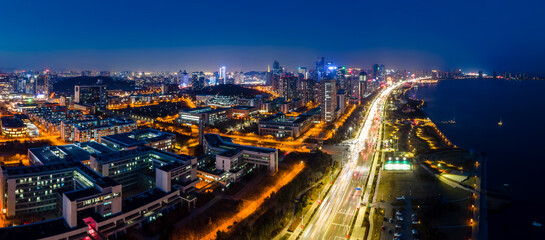 Aerial photography of the night view of the urban architectural landscape of Qingdao, China