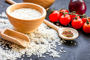 ingredients for paella on dark background