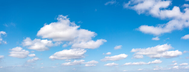 Naklejka na ściany i meble Beautiful blue sky with clouds, wide panorama