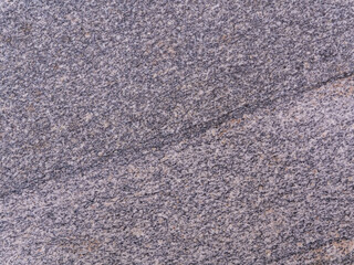 Polished granite slab texture. Stone pattern. Close-up.