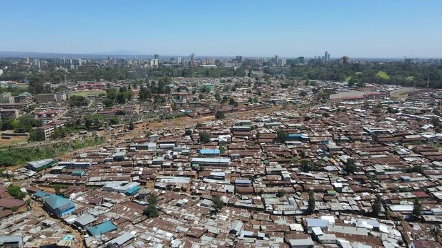 Nairobi Aerial view of sheet metal houses of poor squatters in a dirty settlement of Africa. Drone view of garbage dump country side population of kibera Nairobi Kenya.