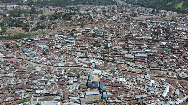 Poor people living in the populated slums of Kibera Kenya. drone view of the drone over the desolation traditional houses of kibera Nairobi Kenya.