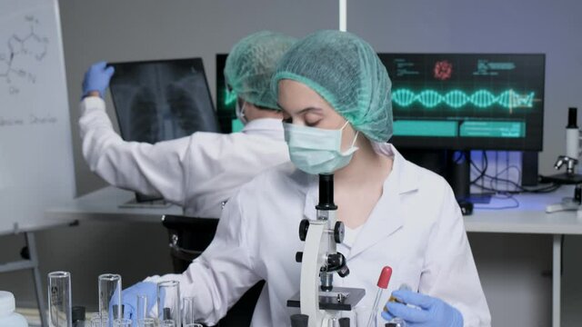 Scientists are researching for Covid19 vaccine in a laboratory. Doctors are testing  a new phamaceutical.