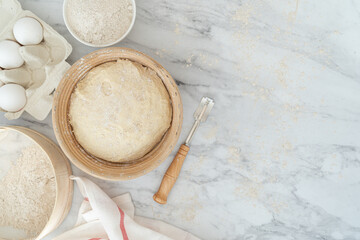 Fototapeta na wymiar Homemade bread concept - ingredients on marble background, top view