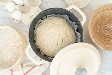 Homemade bread concept - ingredients on marble background, top view