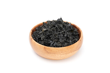 Dried seaweed wakame in wooden bowl isolated on white background. Japanese food
