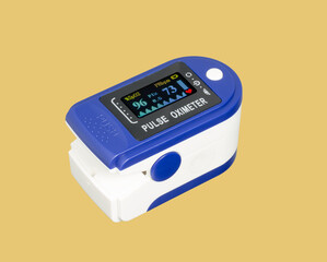 pulse oximeter device for measuring the level of oxygen in the body, isolated on yellow