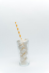 sugar cubes in a glass with a tube high-calorie cocktail