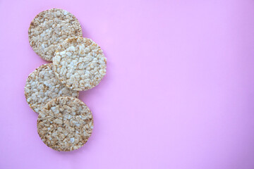 Rice cakes on a pink background with copy space. View from above. 