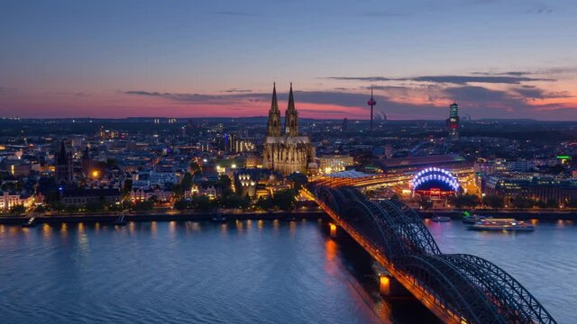 aerial view of cologne city skyline timelapse night to day pan,cityscape time lapse high pov germany sun rising over cathedral