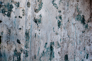 Building board texture. Gray concrete wall, old surface with peeling plaster.