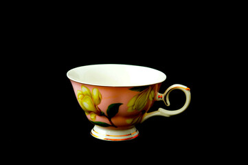 a cup of coffee on a black background