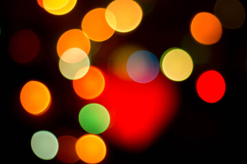 Blurred multicolored lights on a dark background.