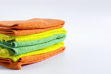 colored cloth cleaning towels close up on a white background stack of towels