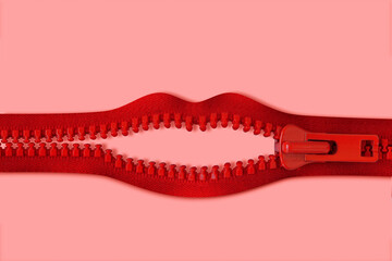 Mouth made of red zipper on pink background - Concept of violence against women and communication issues - 418094409