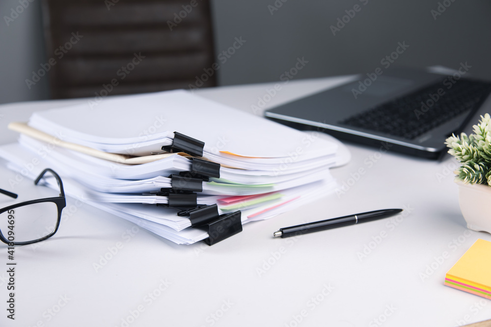 Aufkleber stack of business paper file with laptop computer