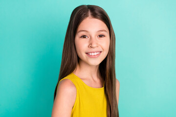 Photo of optimistic nice brown hair girl hand chest wear yellow dress isolated on bright teal color...