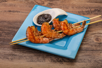 Grilled prawn skewer with pepper sauce