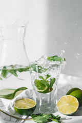 Detox water with lime fruit and mint leaves. Mint fresh homemade lemonade