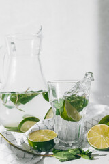 Detox water with lime fruit and mint leaves. Mint fresh homemade lemonade