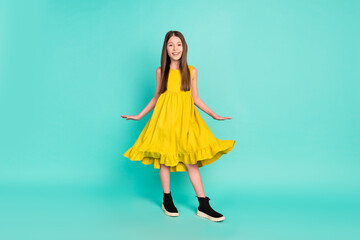 Full size photo of optimistic nice brown hair girl wear yellow dress shoes isolated on bright teal...