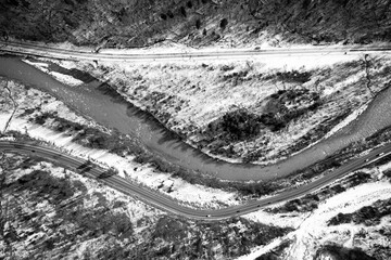 Fototapeta premium Aerial view on mountain road from drone in winter.