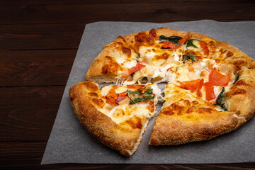 Pizza with cheese, herbs and ham