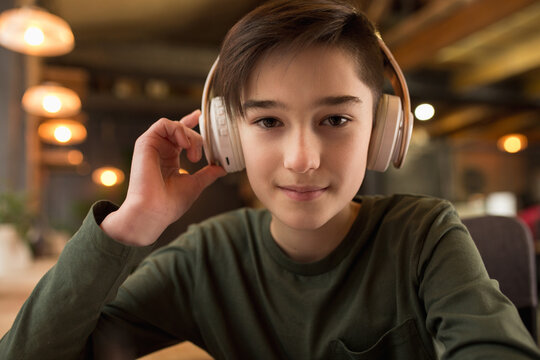 Little boy wearing headphones during online education course, lesson, view of screen. Using headphones. Easy, comfortable usage concept, education, online, childhood, modern technologies for remotion.