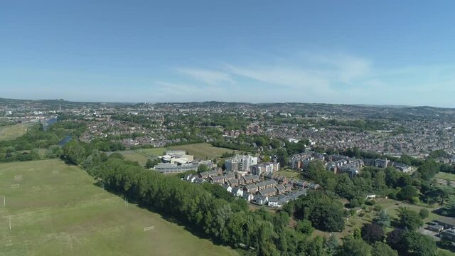 Aerial of a rural suburban estate in the south of england. Sports fields and parks amongst houses