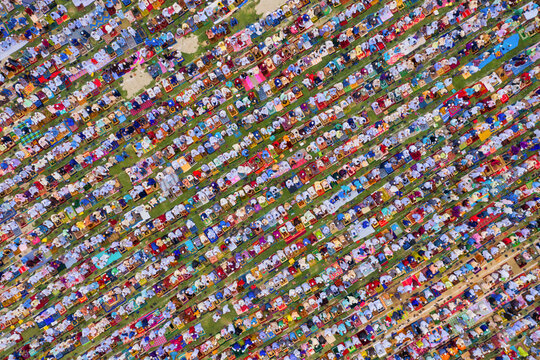 Aerial view of a vast crowd of people worshipping at Gore Shahid park in front of Eid Gah Minar religious site in Dinajpur, Rangpur, Bangladesh.