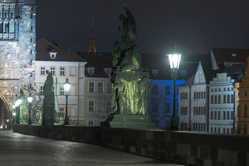 street lantern on empty charles bridge at night in lockdown