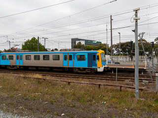 Naklejka premium Commuter train approaching a train station in Melbourne Victoria Australia