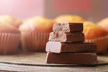 Chocolate pieces on wooden table