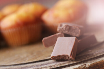 Chocolate pieces on wooden table