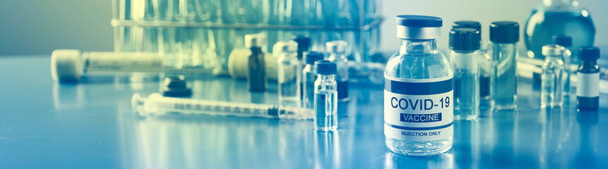 covid-19 vaccine bottle at the lab, web format