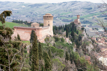 Fototapeta na wymiar Brisighella, Cesena. La Rocca Manfrediana con a fianco la torre dell'Orologio