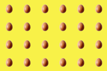 brown egg pattern on yellow background