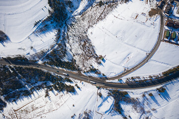 Aerial view on mountain road from drone in