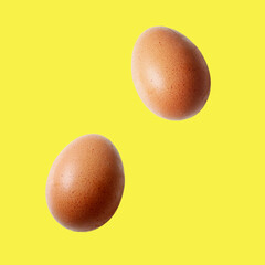 brown egg pattern on yellow background