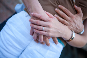 Loving couple holding hands close-up. Love concept. High quality photo