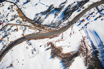 Aerial view on mountain road from drone in