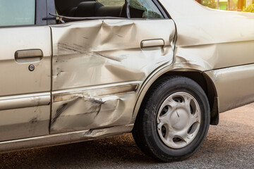 Fototapeta premium The golden Bourne car door was demolished.
